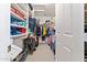 Walk-in closet with neatly organized shelving and hanging storage at 630 W Navarro Ave, Mesa, AZ 85210