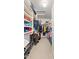Walk-in closet with organized shelving, rods for hanging and a ceiling light at 630 W Navarro Ave, Mesa, AZ 85210