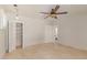 Bedroom featuring tile floors, ceiling fan, closet and open door to other room at 6550 N 7Th St, Phoenix, AZ 85014