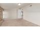 Bedroom featuring carpeted flooring, a bright light fixture, and access to another room at 6550 N 7Th St, Phoenix, AZ 85014