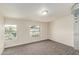 Comfortable carpeted bedroom with bright windows overlooking the street at 6550 N 7Th St, Phoenix, AZ 85014