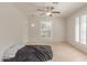 Bright bedroom featuring a bed, tile floors, window with shutters and a closet at 6550 N 7Th St, Phoenix, AZ 85014