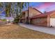 Side exterior view of home with manicured lawn and brick exterior at 6550 N 7Th St, Phoenix, AZ 85014