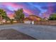Exterior view of home, showcasing the three-car garage and spacious driveway at 6550 N 7Th St, Phoenix, AZ 85014