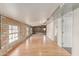Spacious hallway features hardwood floors, exposed brick and ample natural light at 6550 N 7Th St, Phoenix, AZ 85014