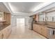 Bright kitchen with granite countertops, light wood cabinetry, and stainless steel refrigerator at 6550 N 7Th St, Phoenix, AZ 85014