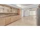 Bright kitchen boasting granite countertops, light wood cabinetry, and a seamless flow into the living area at 6550 N 7Th St, Phoenix, AZ 85014