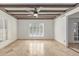 Sun-drenched living room featuring tile floors, ample natural light, and custom window shutters at 6550 N 7Th St, Phoenix, AZ 85014