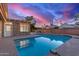 Backyard pool with beautiful sunset colors reflecting off the water at 6550 N 7Th St, Phoenix, AZ 85014