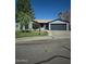 Charming single-story home featuring a two-car garage and well-maintained front yard at 696 W Shawnee Dr, Chandler, AZ 85225