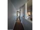 Hallway featuring wood floors and leading to other rooms in the house at 696 W Shawnee Dr, Chandler, AZ 85225