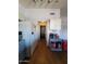 Functional kitchen with white appliances, ample cabinetry, and wood flooring leading to the doorway at 696 W Shawnee Dr, Chandler, AZ 85225