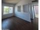 Open living room area featuring dark wood floors and bright natural light at 696 W Shawnee Dr, Chandler, AZ 85225