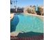 Sparkling in-ground pool with brick trim, surrounded by landscaping, offers a refreshing oasis for summer fun at 696 W Shawnee Dr, Chandler, AZ 85225