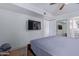 Spacious bedroom with a TV and closet space at 8055 E Thomas Rd # C203, Scottsdale, AZ 85251
