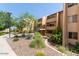 Apartment building exterior showcases well-maintained landscaping, offering a serene environment with accessible walkways and stairs for residents at 8055 E Thomas Rd # C203, Scottsdale, AZ 85251