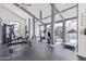 Well-lit gym with modern equipment, high ceilings, and ample natural light at 8055 E Thomas Rd # C203, Scottsdale, AZ 85251