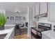 Modern kitchen has neutral decor with essential appliances, providing a clean, functional cooking and dining experience at 8055 E Thomas Rd # C203, Scottsdale, AZ 85251