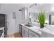 Contemporary kitchen is equipped with sleek countertops, ample cabinet space, and modern stainless steel appliances for a culinary enthusiast at 8055 E Thomas Rd # C203, Scottsdale, AZ 85251