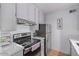 Cozy kitchen with stainless steel appliances and ample cabinet space at 8055 E Thomas Rd # C203, Scottsdale, AZ 85251