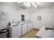 Community laundry room with washing machines at 8055 E Thomas Rd # C203, Scottsdale, AZ 85251