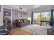 Comfortable living area with a plush sofa, stylish decor, and a private balcony ideal for enjoying the outdoors and relaxing at 8055 E Thomas Rd # C203, Scottsdale, AZ 85251