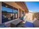 Inviting outdoor patio with stylish seating and a view of the landscaped surroundings at 8055 E Thomas Rd # D111, Scottsdale, AZ 85251