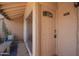 Cozy front porch with seating, a decorative door, and unit number D111 at 8055 E Thomas Rd # D111, Scottsdale, AZ 85251