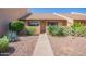 Charming single-story home with desert landscaping and a welcoming walkway at 8055 E Thomas Rd # D111, Scottsdale, AZ 85251