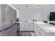 Modern kitchen features stainless steel appliances, white cabinetry, and ample counter space at 8055 E Thomas Rd # D111, Scottsdale, AZ 85251