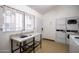 Functional laundry area with washers and dryers, a utility sink, and security window at 8055 E Thomas Rd # D111, Scottsdale, AZ 85251