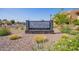 Community sign for Woodland Springs Condominiums amidst manicured landscaping at 8055 E Thomas Rd # D111, Scottsdale, AZ 85251