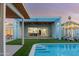 Stylish backyard with a pool, manicured lawn, and a covered patio, perfect for entertaining and relaxation at 8308 E Mariposa Dr, Scottsdale, AZ 85251