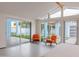 Bright bedroom with modern furniture, glass door, and views of the backyard pool at 8308 E Mariposa Dr, Scottsdale, AZ 85251