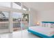 Bright bedroom featuring a modern bed frame, white walls, and large windows with neighborhood views at 8308 E Mariposa Dr, Scottsdale, AZ 85251