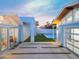 Modern home with a bright blue exterior, connecting pathways, and a pool area perfect for entertaining and outdoor living at 8308 E Mariposa Dr, Scottsdale, AZ 85251