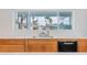 Modern kitchen sink with stainless steel fixtures and ample countertop space at 8308 E Mariposa Dr, Scottsdale, AZ 85251