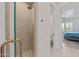 Walk-in shower with gold hardware in a bright bathroom near the main bedroom at 8974 E Rusty Spur Pl, Scottsdale, AZ 85255