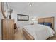 Bright bedroom with hardwood floors, ceiling fan, and decorative bull art at 8974 E Rusty Spur Pl, Scottsdale, AZ 85255