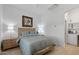 Bright bedroom featuring hardwood floors, two nightstands, and stylish headboard at 8974 E Rusty Spur Pl, Scottsdale, AZ 85255