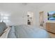 Light filled bedroom featuring a private entrance to a beverage center at 8974 E Rusty Spur Pl, Scottsdale, AZ 85255