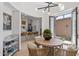 Bright dining area features a round table, natural light, and an open layout to the kitchen and outdoor patio at 8974 E Rusty Spur Pl, Scottsdale, AZ 85255