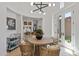 Bright dining area adjacent to the kitchen, featuring elegant decor and a stylish chandelier at 8974 E Rusty Spur Pl, Scottsdale, AZ 85255
