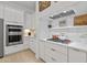 Gourmet kitchen boasts marble countertops, high-end stainless steel appliances, and custom cabinetry at 8974 E Rusty Spur Pl, Scottsdale, AZ 85255
