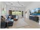 Bright living room with high ceilings, large windows, and modern furnishings at 8974 E Rusty Spur Pl, Scottsdale, AZ 85255