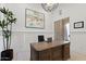 Stylish home office with custom wood desk, modern decor, and bright natural light at 8974 E Rusty Spur Pl, Scottsdale, AZ 85255