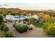 Expansive desert home featuring solar panels, lush landscaping, and outdoor entertainment with mountain views at 9035 W Villa Chula --, Peoria, AZ 85383