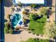 An aerial view of a backyard with a swimming pool, lounge area, manicured lawn, and desert landscaping at 9035 W Villa Chula --, Peoria, AZ 85383