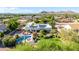 Aerial view showcases the home's pool, landscaping, solar panels, and mountain views at 9035 W Villa Chula --, Peoria, AZ 85383