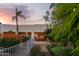 Backyard with patio area, mature landscaping and a view of the house at 9035 W Villa Chula --, Peoria, AZ 85383